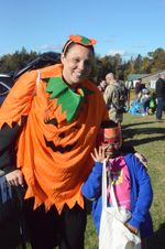 a child and mother in costumes
