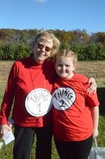 two people posing in red sweatshirts