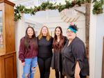 four women pose