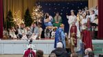 men dressed as the magi in front of the ohter cast members