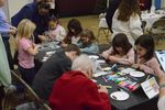 people of different ages at a craft table