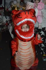 A child in a T-Rex costume