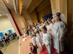 children dressed as angels singing