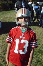 a child dressed as a football player