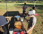 someone cooking at a grill